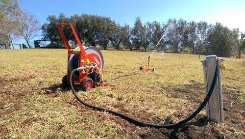 red irrigator on dry land